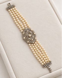 Elegant vintage MONET statement bracelet featuring multiple strands of creamy faux pearls