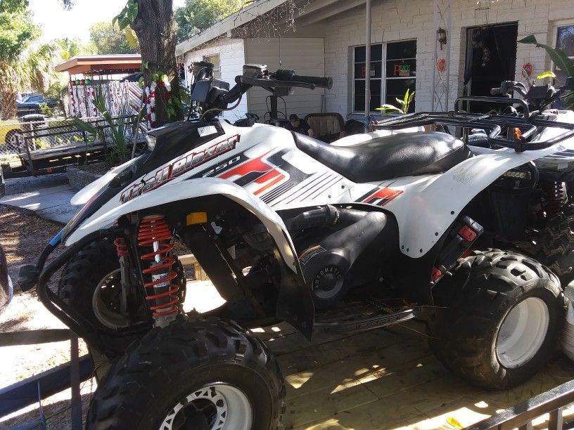 2 Atvs and trailer.polaris 2005 Traiblazer 250,polaris 1997 Trailboss