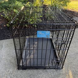 Small 24x18x21 Dog Crate with Tray and Two Doors and double locks, in good shape. 
