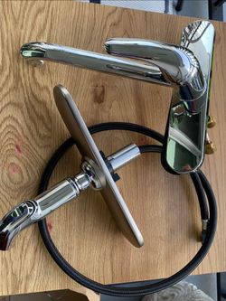 Brand new kitchen sink faucet with integrated soap pump dispenser.
