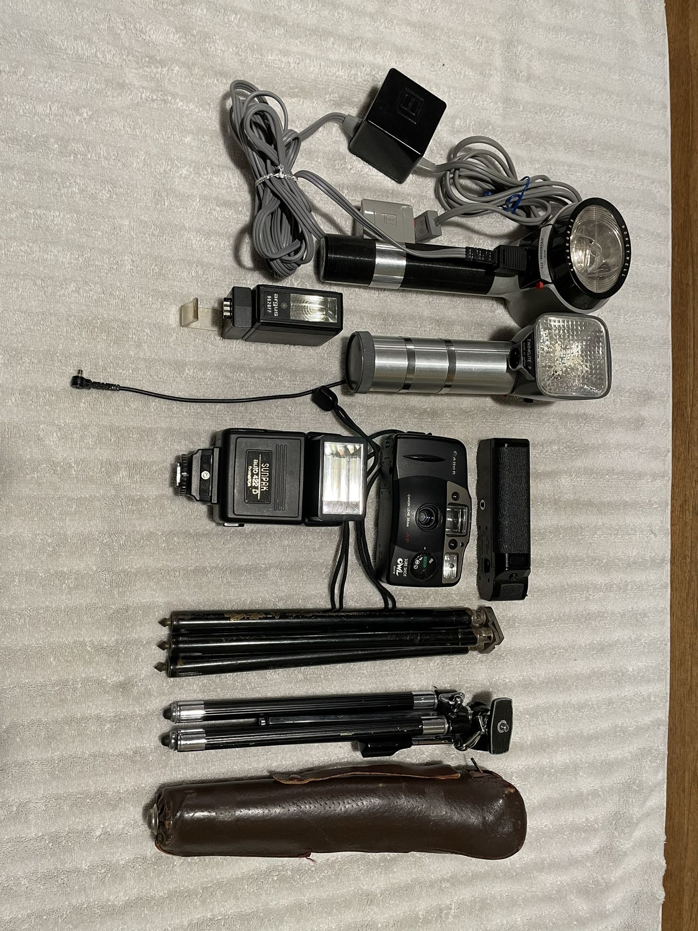 Canon Sure Shot 35mm Camera, Flashes, Tripods And Equipment 