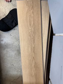 “10 unopened boxes + 9 extra full planks — approx. 258 sq. ft. Of SPC Flooring