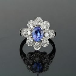 14kt White Gold Tanzanite Ring Oval 1.00 CT 8.05 x 6mm .55 CTW Diamond Ring 2mm Diamonds and 30 1-1.5mm Diamonds  Size 7 weight is 5.54 grams