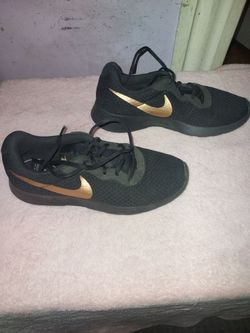 Nike Tanjun Black and Gold Sneakers