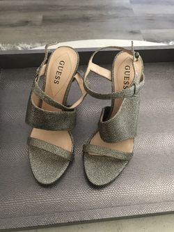 Guess Women’s Shoes size 7.5. Silver with 2 inch heel.