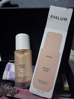 The PHLUR Beach Skin Shimmering Body Oil