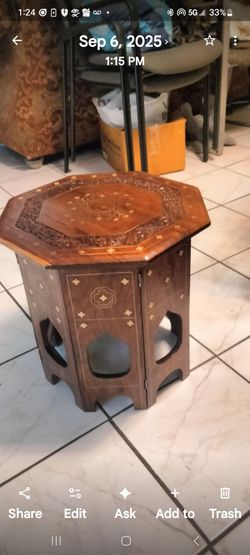 A pair of mahogany handmade moroccan side tables