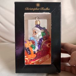 Christopher Radko Purple-Hatted Santa in Red Sleigh Hanging Ornament