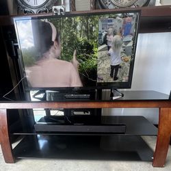 Smart tv, stand and sound bar 