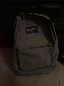 Jansport gray backpack for sell in the area of San Jacinto in good condition only had it for a month