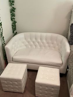 White couch and footrests