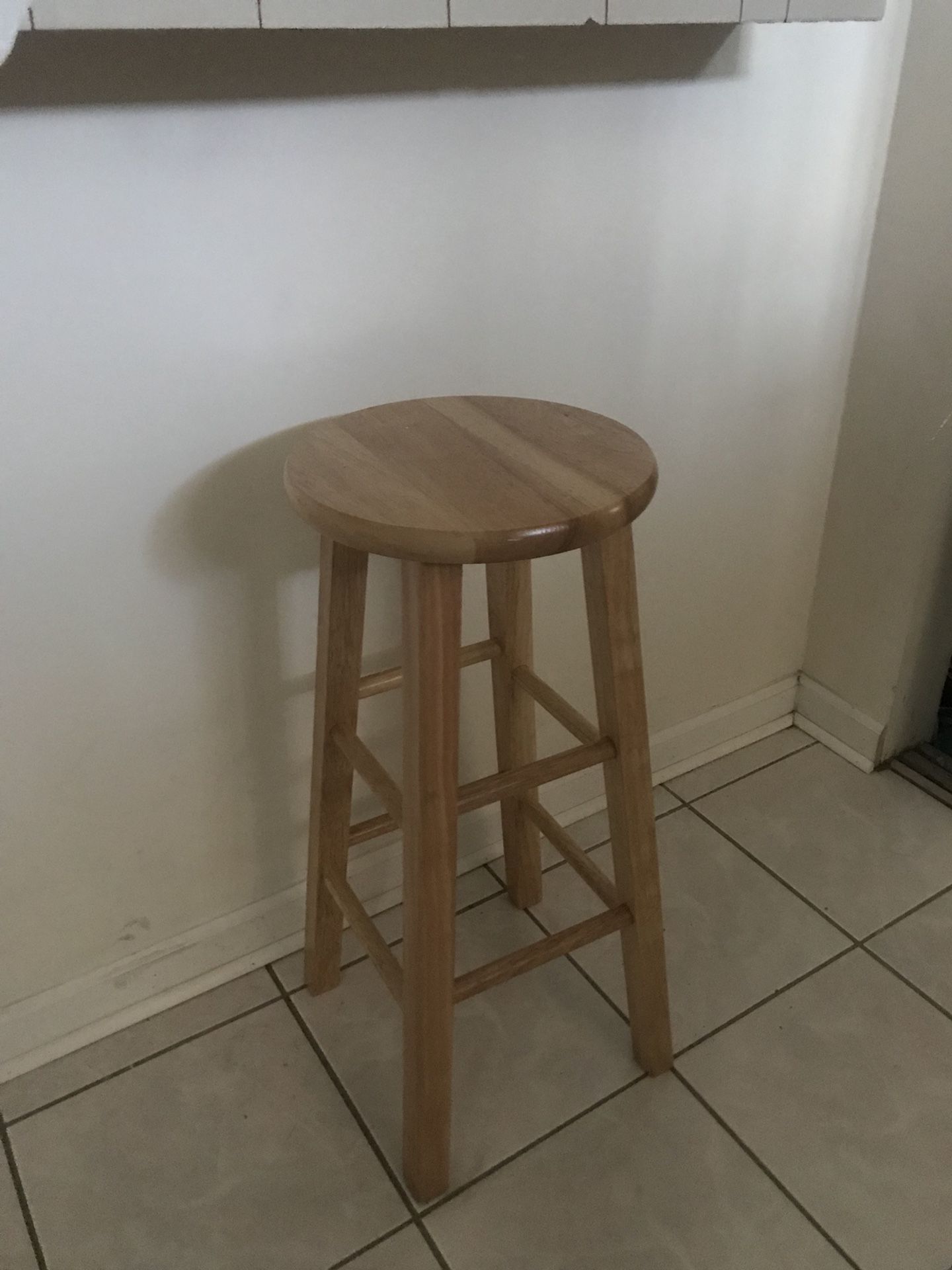 Two wooden bar stools