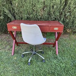 Office desk and swivel gray chair with wheels