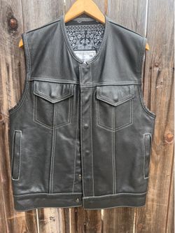 Espinozas custom vest