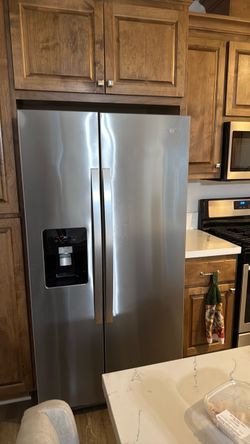 Whirlpool side-by-side refrigerator with icemaker and water