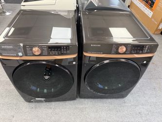 Samsung black stainless steel front load washer and dryer set