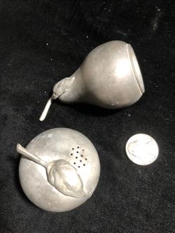 Vintage pewter apple and pear shakers.