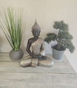 Buddha Statue And Faux Plant