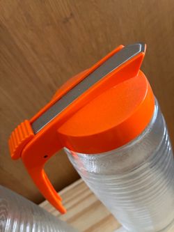 Clear Water Bottle with Orange Flip Lid