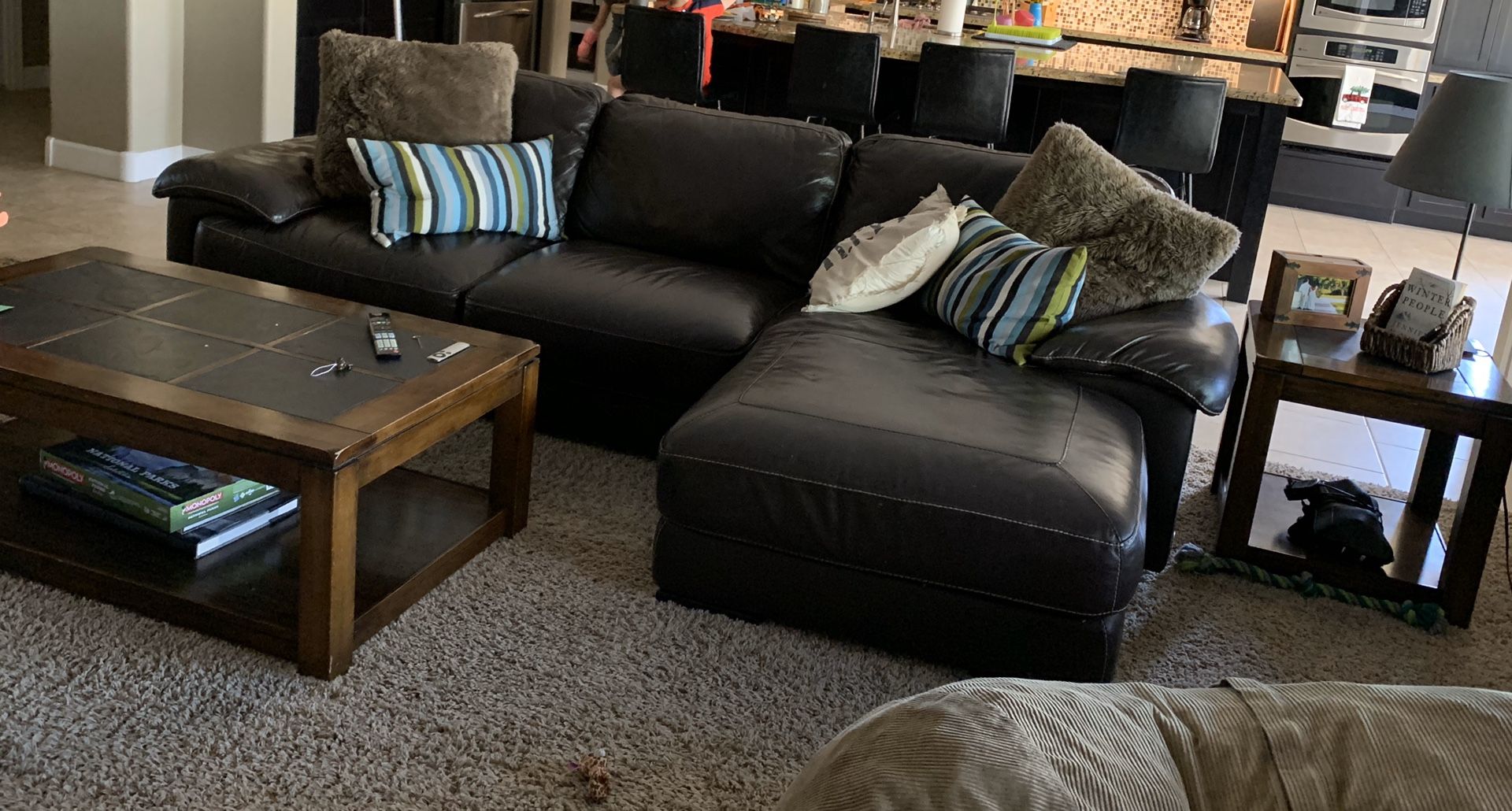 Leather couch and chaise, coffee table and end table