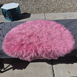 2 pink throw rugs, round and rectangular