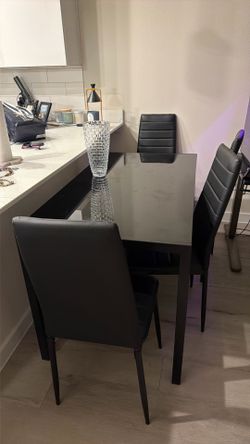Glass top black table with 6 chairs