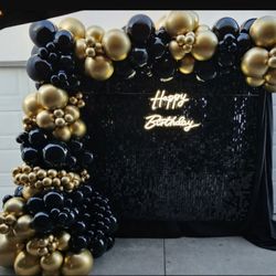 Shimmer Wall With A Balloon Garland 