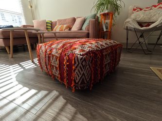 Red patterned woven floor pouf