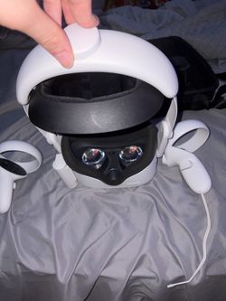 Oculus with grips and a head strap and a battery pack