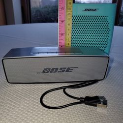 Two Bose SoundLink Speakers Bluetooth One Agua Blue Portable Speaker  One Gray Mini Speaker 
