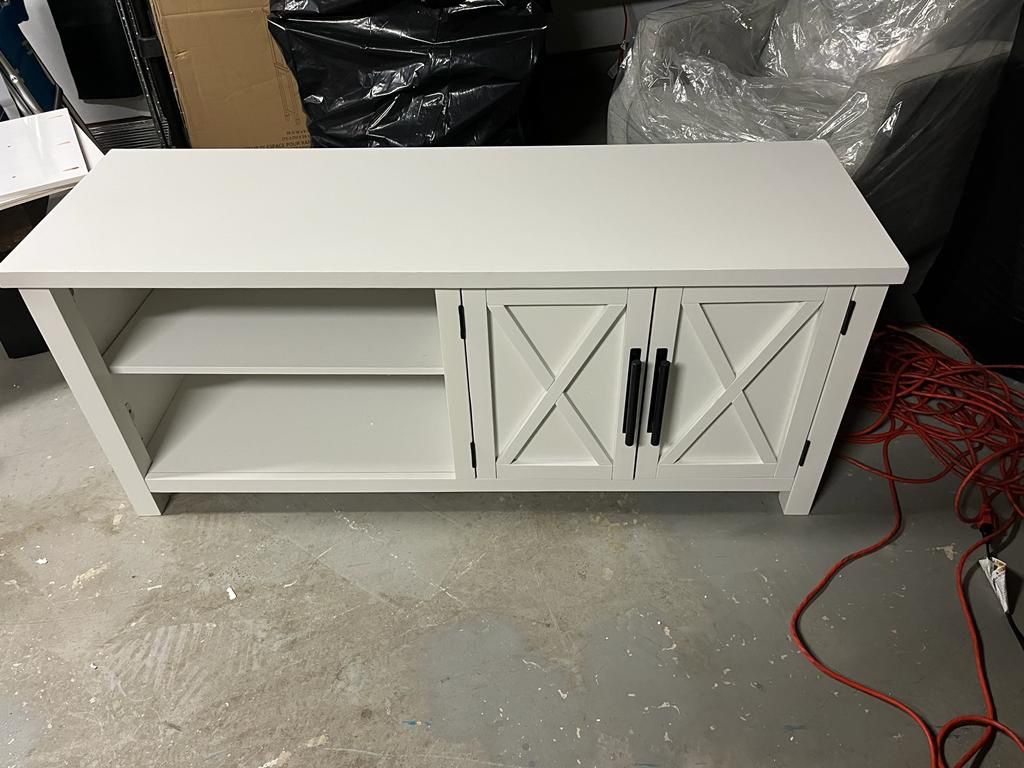 Bee & Willow™ Crossey TV Stand in WHITE (Small Damage) See  Last Pic Dins 56" W x 18" D x 24" H (assembled) Weighs 79.37 lb. 150 lb. weight capacity