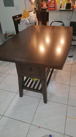 Table w/swivle chairs and a bench