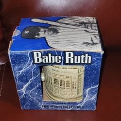 Babe Ruth Yankee Stadium collectible stein or mug. 
It is a "Pine Sports Collectible".
The packaging features a black and white illustration of Babe R