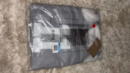 Gray Textile Item in Original Packaging