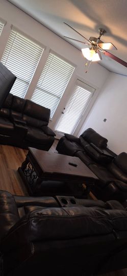 Faux leather couches and bar stools