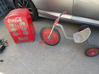 Vintage tricycle and coke fridge