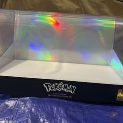 Jazwares Pokemon display case with a deluxe holographic cover lid.
