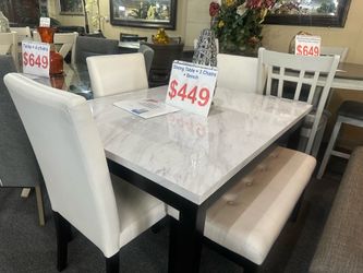 Brand new white faux marble table and 4 chairs ( free delivery within 10miles
