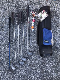 Golf bag with clubs, balls, tees