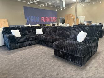 Oversized black sectional w/ white accents