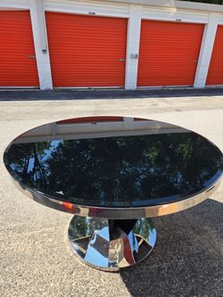 Cecilia Silver dining table with two tabletops.