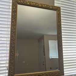 Gold trim wall mirror