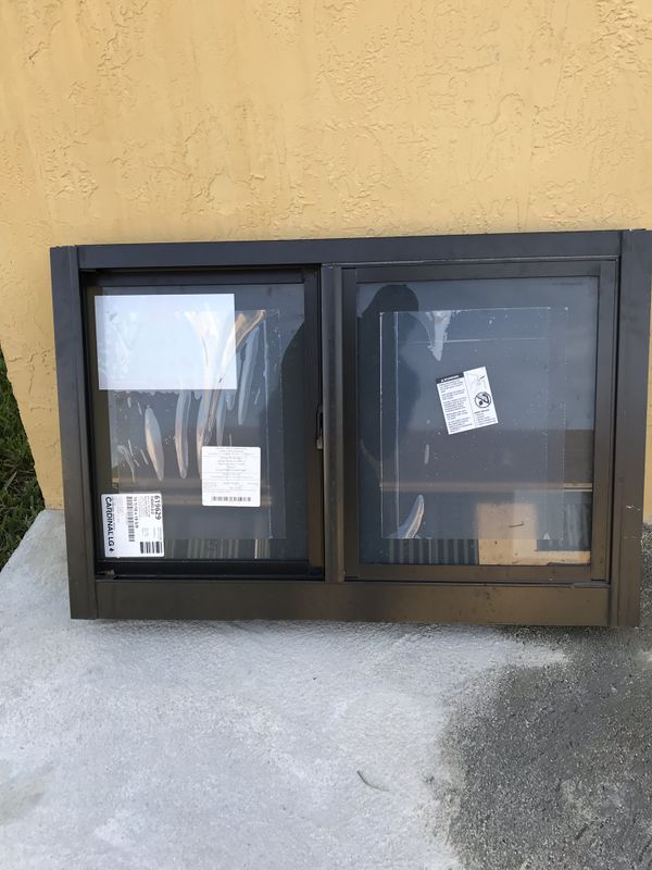 Bronze Rolling Full View w gray glass Impact window for 