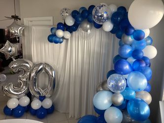 Organic arch with columns number 40” and 2 helium balloons $200 complete set up with curtains $250 centerpiece with vinyl personalized $25 each