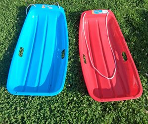 2 new plastic sleds