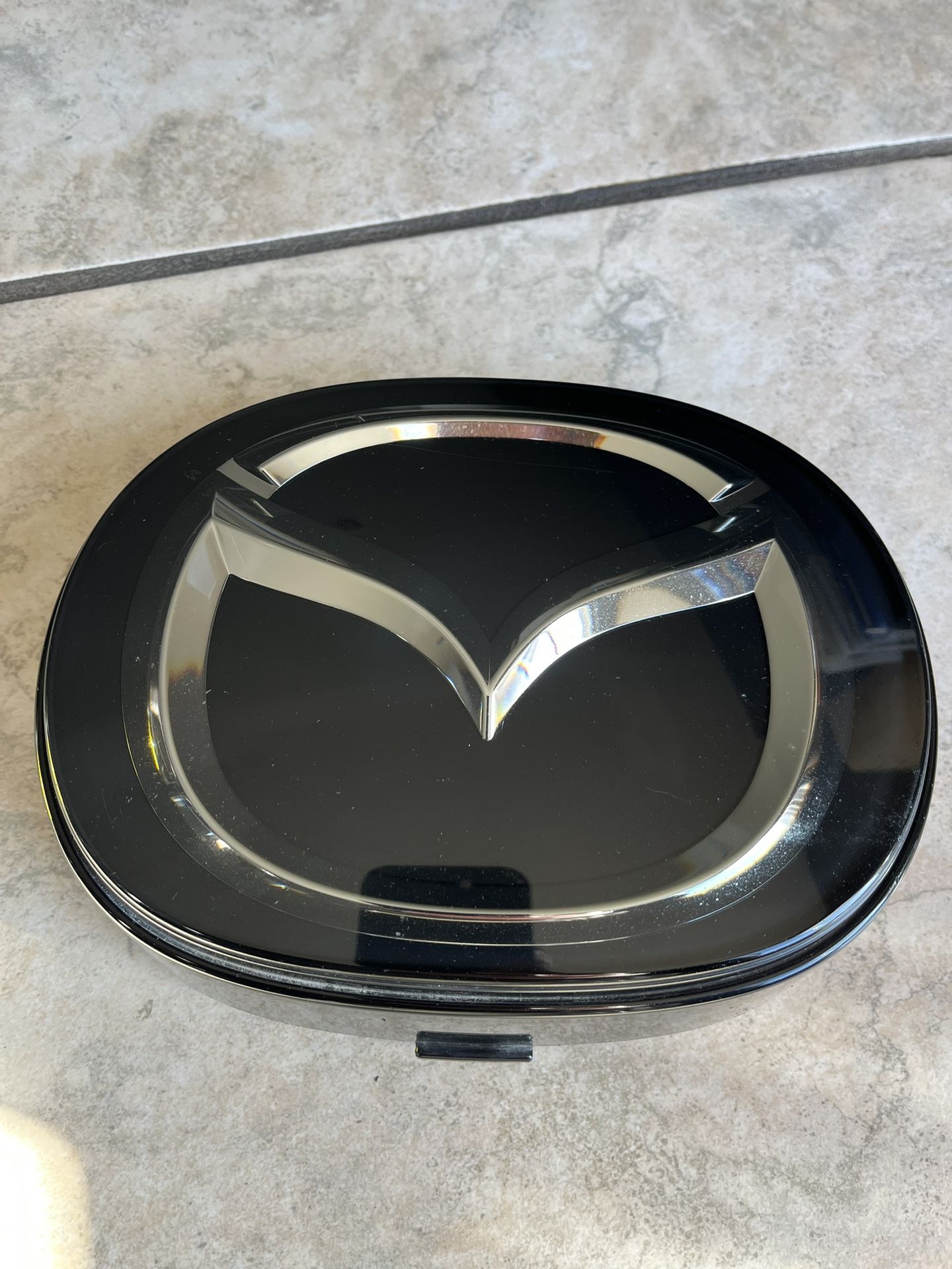 Mazda Emblem Part #TK79-51730