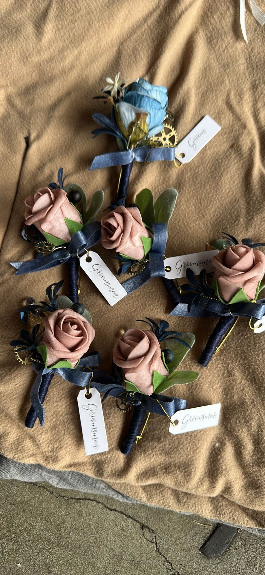Boutonnieres, one for groom, the others for groomsmen