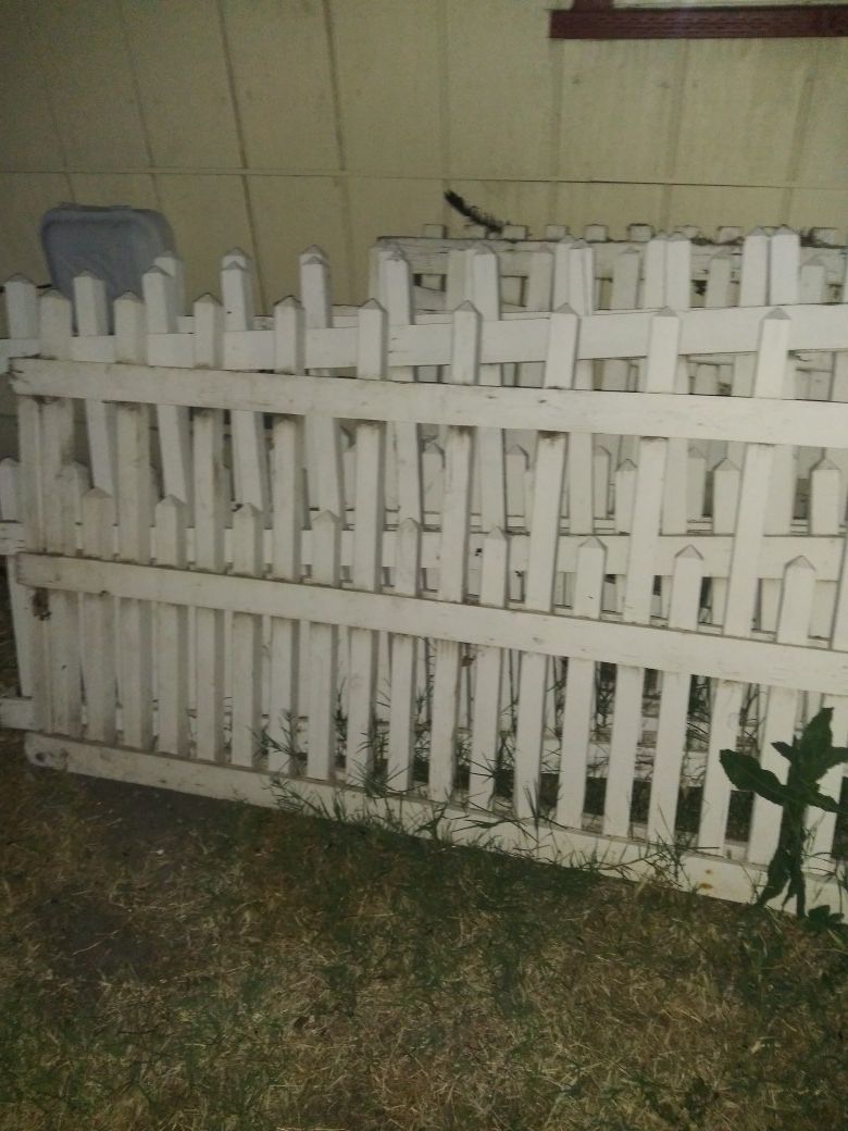 Free picket white fence and a fake tree