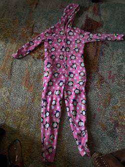 Girl’s pink fuzzy onesie pajamas