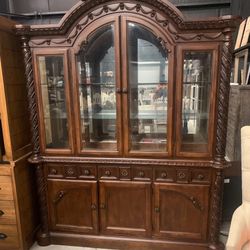 Ashly millennium north shore dinning room cabinet in a dark brown finish